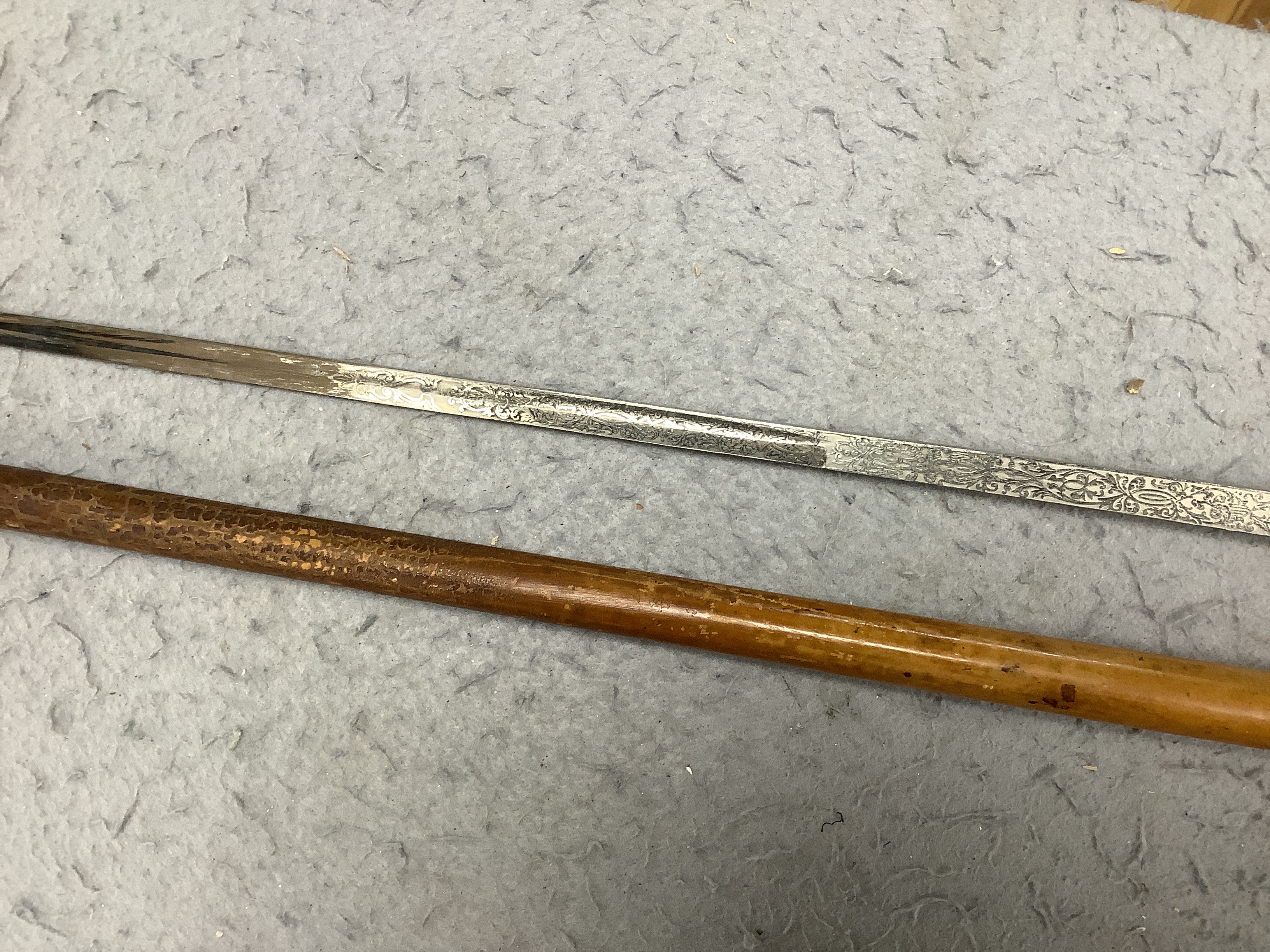 Four Victorian silver mounted handled walking sticks: one being a sword stick, sword stick 90cm long